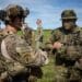 ANDERSEN AIR FORCE BASE, Guam – A U.S. Army Green Beret with 1st Battalion, 1st Special Forces Group (Airborne), discusses mission planning with a member of the Japan Ground Self-Defense Force