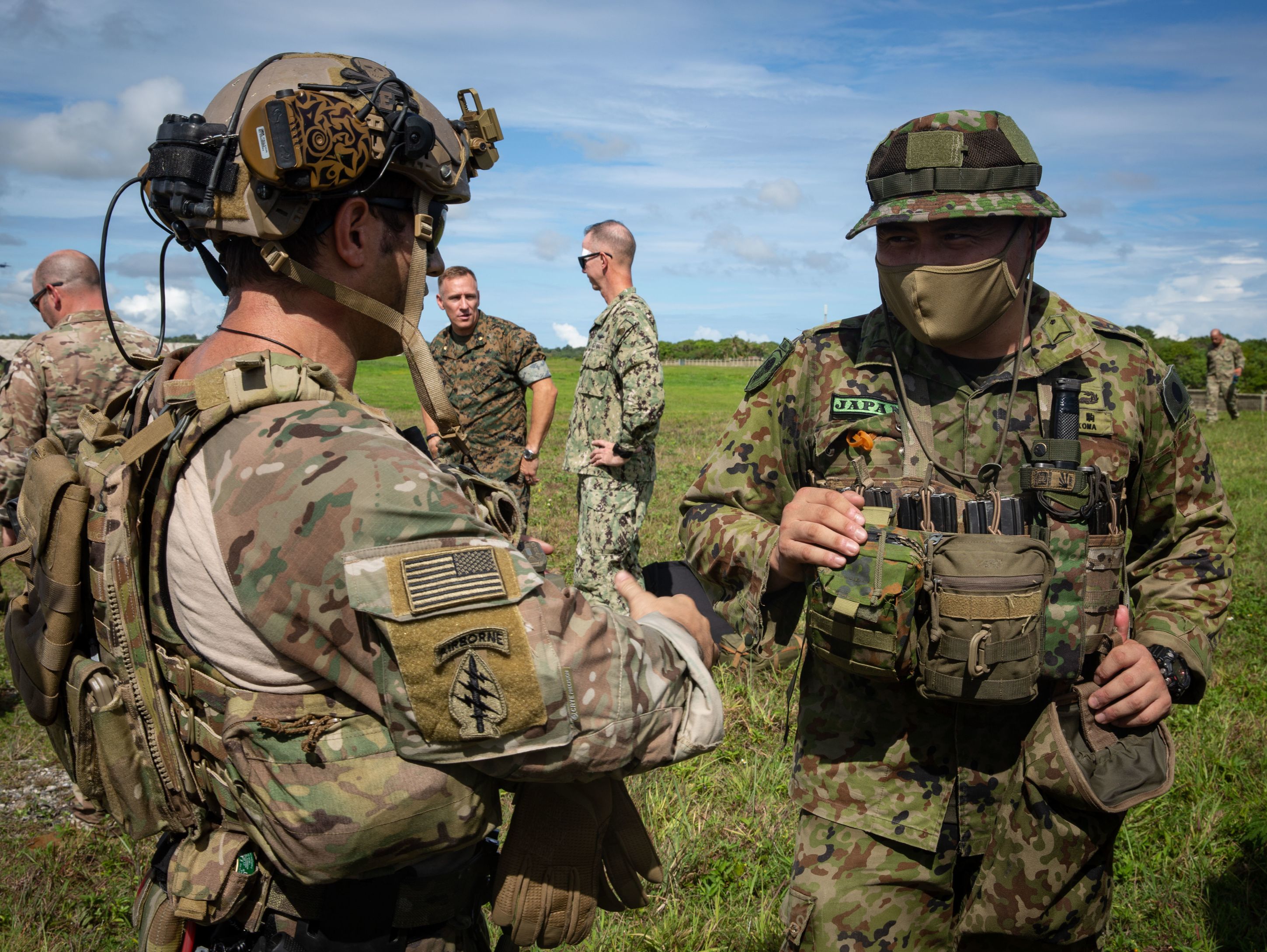 ANDERSEN AIR FORCE BASE, Guam – A U.S. Army Green Beret with 1st Battalion, 1st Special Forces Group (Airborne), discusses mission planning with a member of the Japan Ground Self-Defense Force