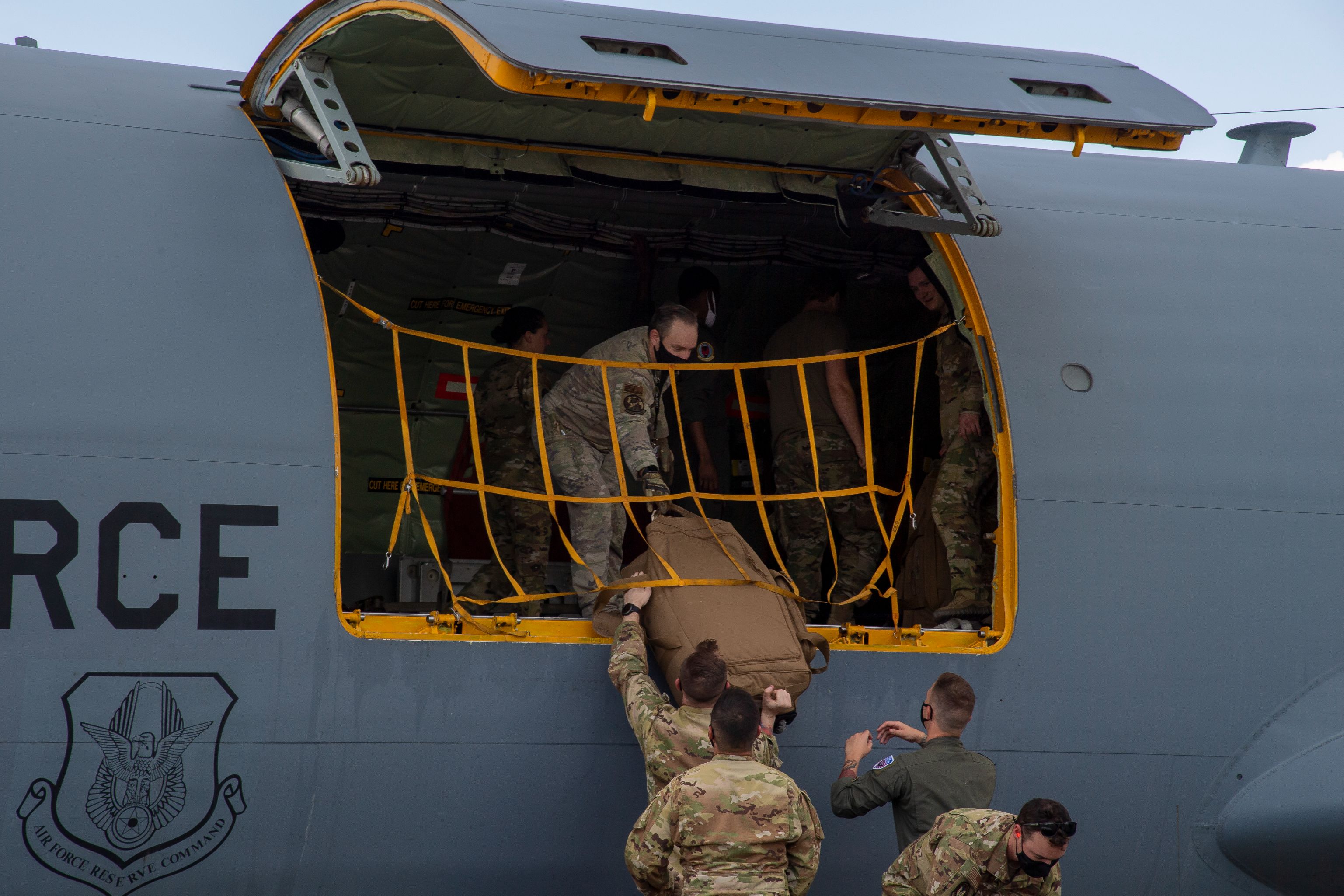 Airmen from the 91st Air Refueling Squadron (ARS) unload a KC-135 Stratotanker aircraft at MacDill Air Force Base, Florida, Sept. 8, 2021. The 91st ARS returned home after completing a deployment in the U.S. Central Command area of responsibility. (U.S. Air Force photo by Airman 1st Class Hiram Martinez)