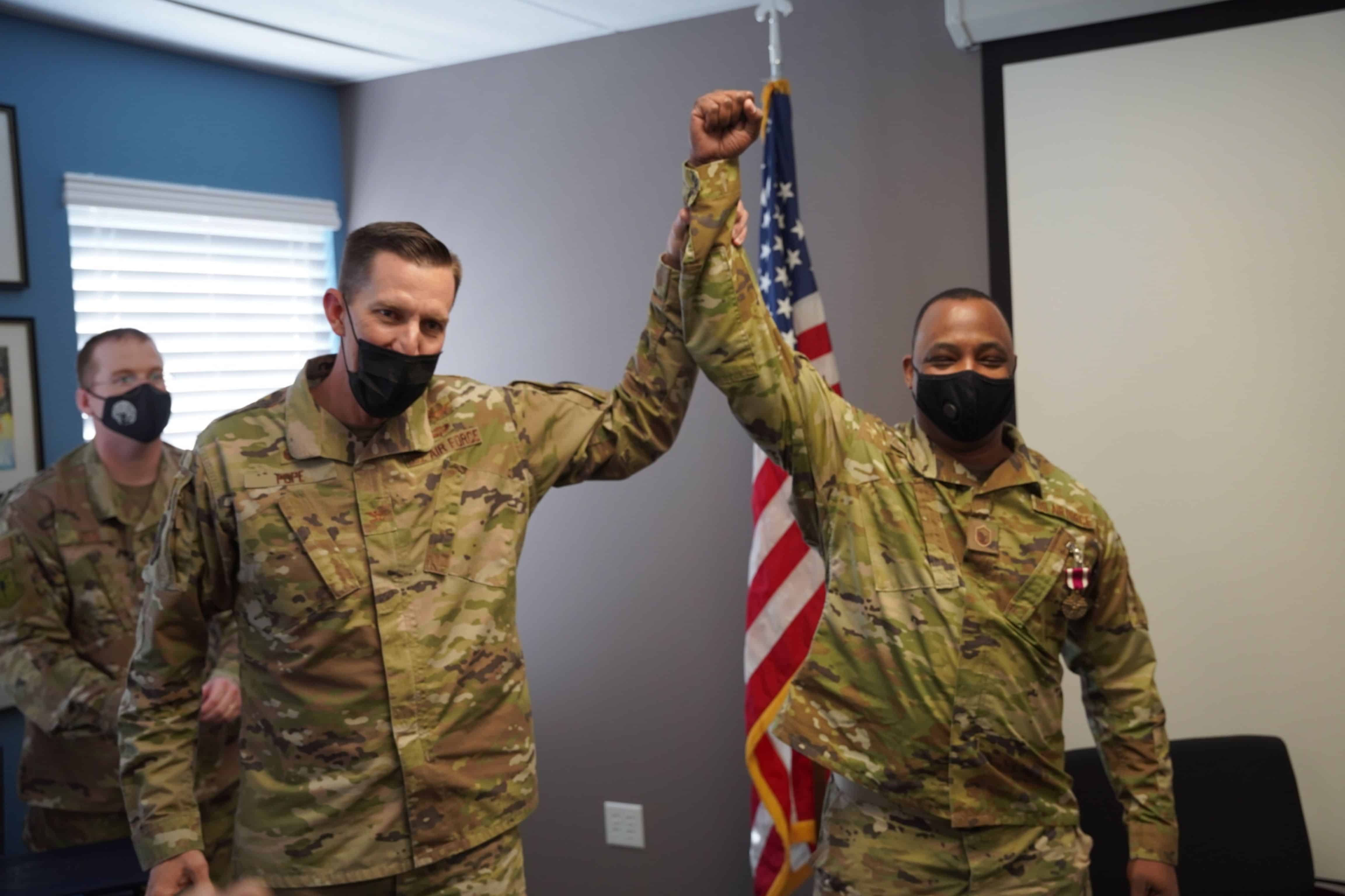 U.S. Air Force Master Sgt. Whitsey receives a standing ovation for his service, comradery, and hard work, prompted by Col. Billy Pope, during the conclusion of his retirement ceremony, hosted by the 690th Cyberspace Operations Group, Oct. 27, 2021 at Port San Antonio, Texas.