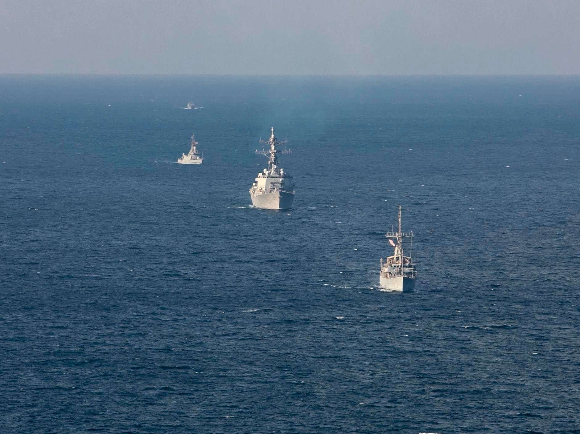 221104-N-UL352-1605 ARABIAN GULF (Nov. 4, 2022) Mine countermeasure ship USS Devastator (MCM 6), front, and guided-missile destroyer USS Delbert D. Black (DDG 119) sail in formation with Royal Saudi Naval Forces ships during exercise Nautical Defender in the Arabian Gulf