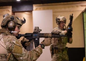 Operators from a U.S. Naval Special Warfare Unit shoot simulated targets while rehearsing close quarter combat scenarios alongside the Australian Army 2nd Commando Regiment at Holsworthy Barracks in New South Wales, Australia during Talisman Sabre