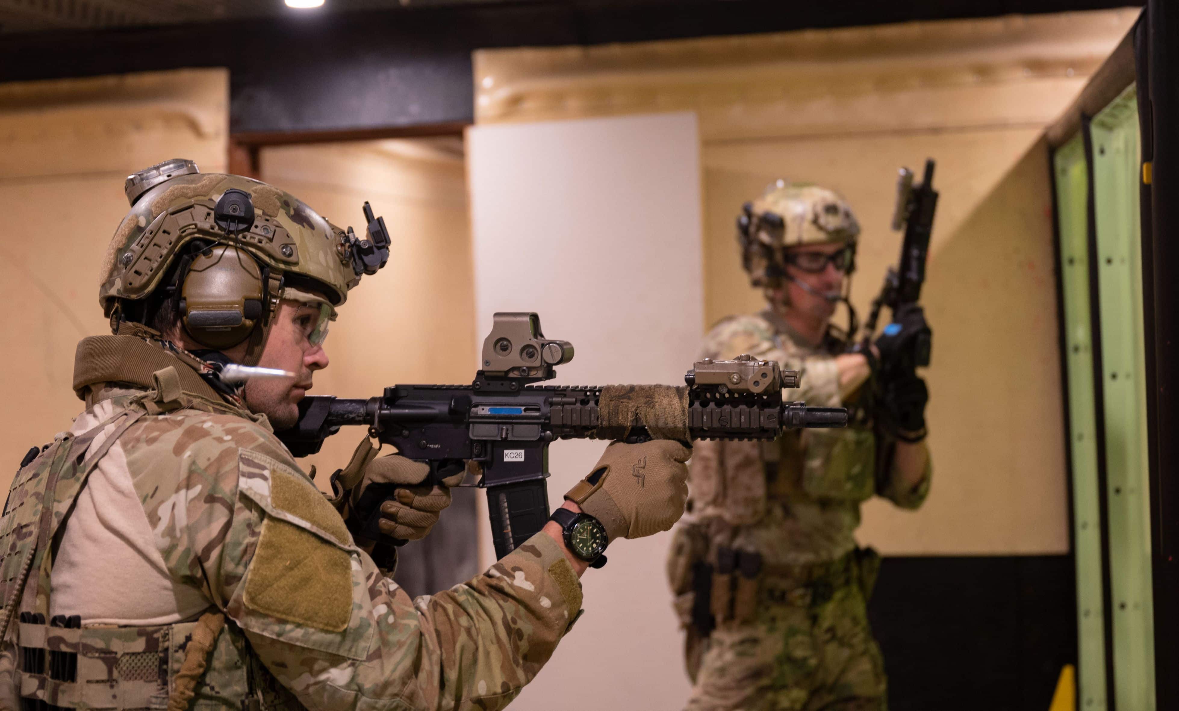 Operators from a U.S. Naval Special Warfare Unit shoot simulated targets while rehearsing close quarter combat scenarios alongside the Australian Army 2nd Commando Regiment at Holsworthy Barracks in New South Wales, Australia during Talisman Sabre