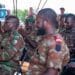 Benin Armed Forces soldiers applaud during a graduation ceremony for members that participated in a Civil Affairs Joint Combined Exchange Training