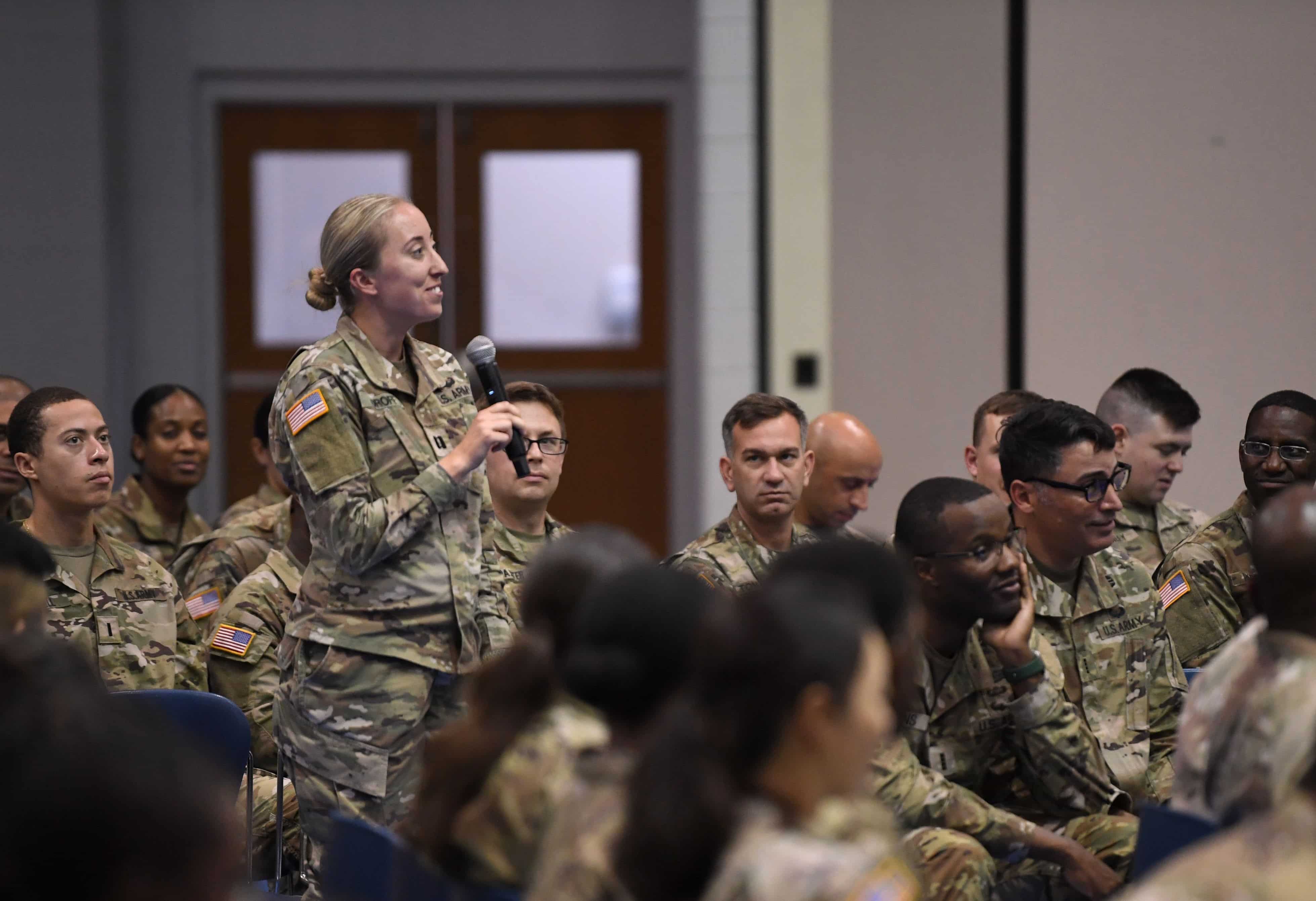 Capt. Erica Loroff, with the Soldier Support Institute, asks a question to Maj. Gen. Thomas R. Drew, commander, Army Human Resources Command, during Drew’s lecture, Aug. 15.