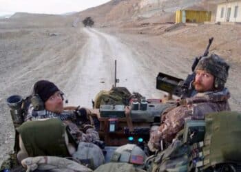 Delta Force legend Robert Horrigan with his comrade in military vehicle
