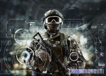 Soldier special forces in glasses with weapons in their hands on a futuristic background. Military concept of the future.