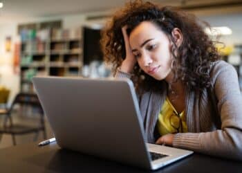 Student woman finding it difficult at study and comprehend scool tasks