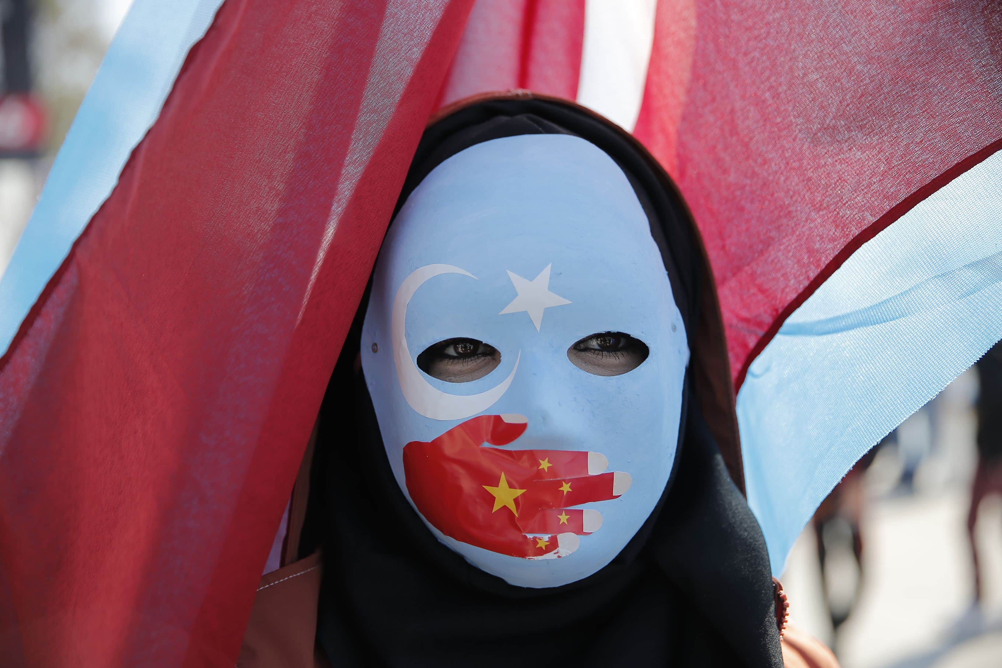 Ethnic Uighurs are seen during a protest against China near the Chinese Consulate in Istanbul, Turkey, December 15, 2019.