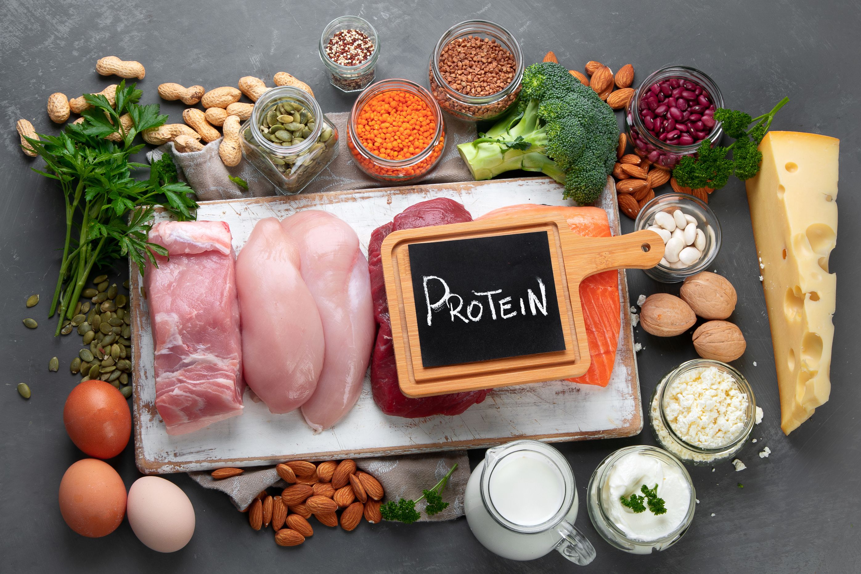 Best products high in protein. Healthy eating and diet concept. Top view, chalkboard