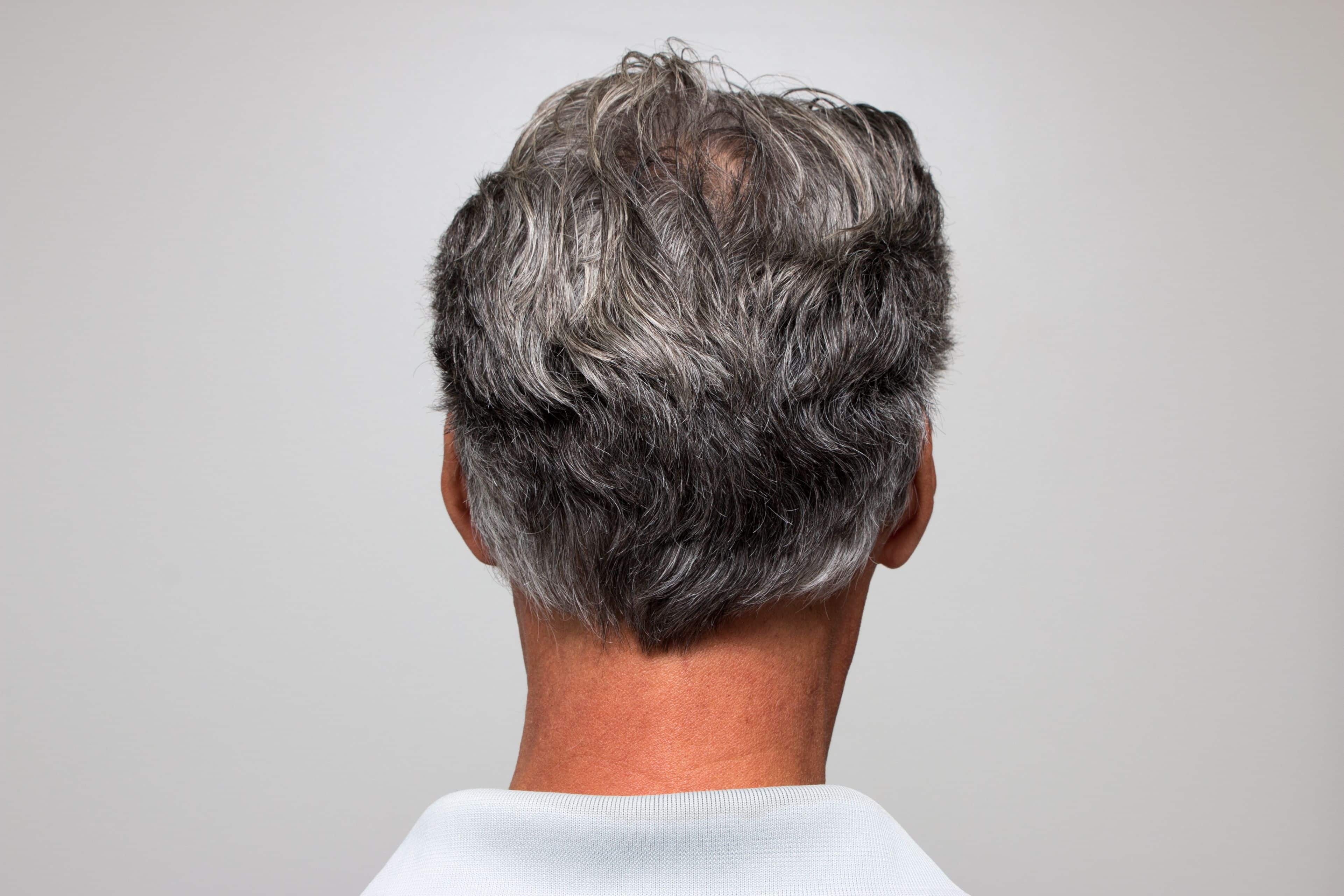 Mature man with salt and pepper hair starting to turn gray