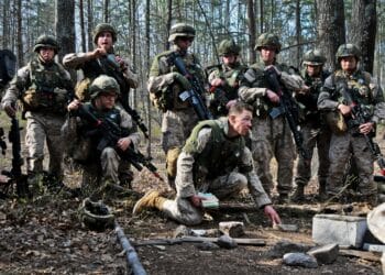 2nd Lt. Justin Kistner, 5th Platoon, Alpha Company, The Basic School, asks a question over the scheme of maneuver during a training exercise on military operations in urban terrain at Camp Barrett, March 27. Fifth platoon was given the objective of clearing and securing the buildings of all enemy insurgents.