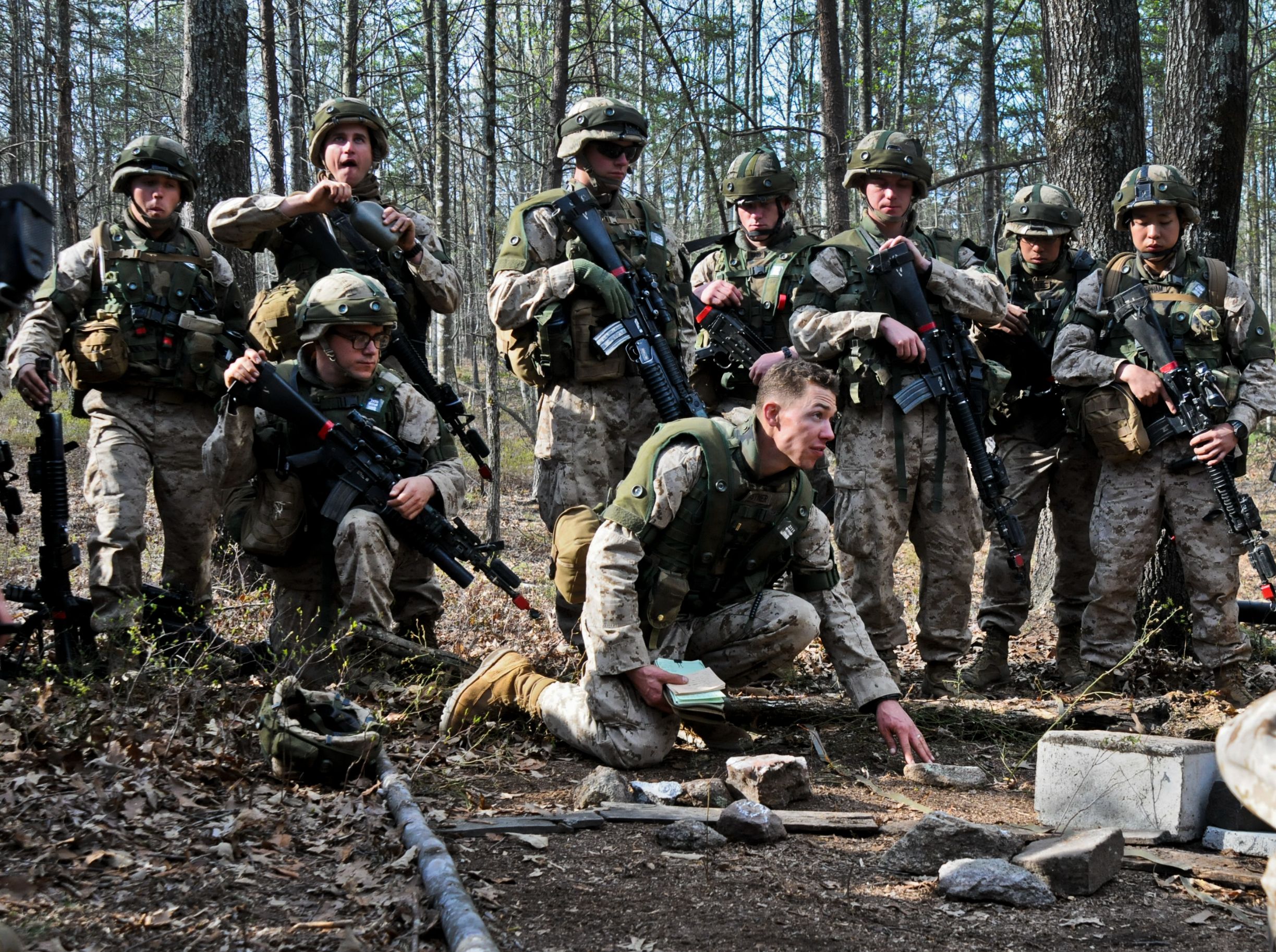 2nd Lt. Justin Kistner, 5th Platoon, Alpha Company, The Basic School, asks a question over the scheme of maneuver during a training exercise on military operations in urban terrain at Camp Barrett, March 27. Fifth platoon was given the objective of clearing and securing the buildings of all enemy insurgents.