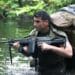A Special Forces candidate assigned to the U.S. Army John F. Kennedy Special Warfare Center and School crosses a water obstacle during the final phase of field training known as Robin Sage in central North Carolina, July 9, 2019. Robin Sage is the culmination exercise and has been the litmus test for Soldiers striving to earn the Green Beret for more than 40 years. (U.S. Army photo illustration by K. Kassens)