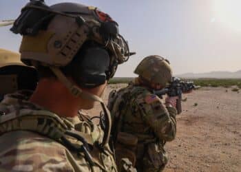 A Green Beret assigned to 3rd Special Forces Group (Airborne) evaluates a Michigan National Guard Soldiers fire an M4 rifle during a training exercise at Camp McGregor, New Mexico March 27, 2020. The training exercise focused on enhancing a wide variety of skillsets for the participating Green Berets and Soldiers such as weapons training and medical training to prepare them for future operations. (U.S. Army photo by Spc. Peter Seidler)