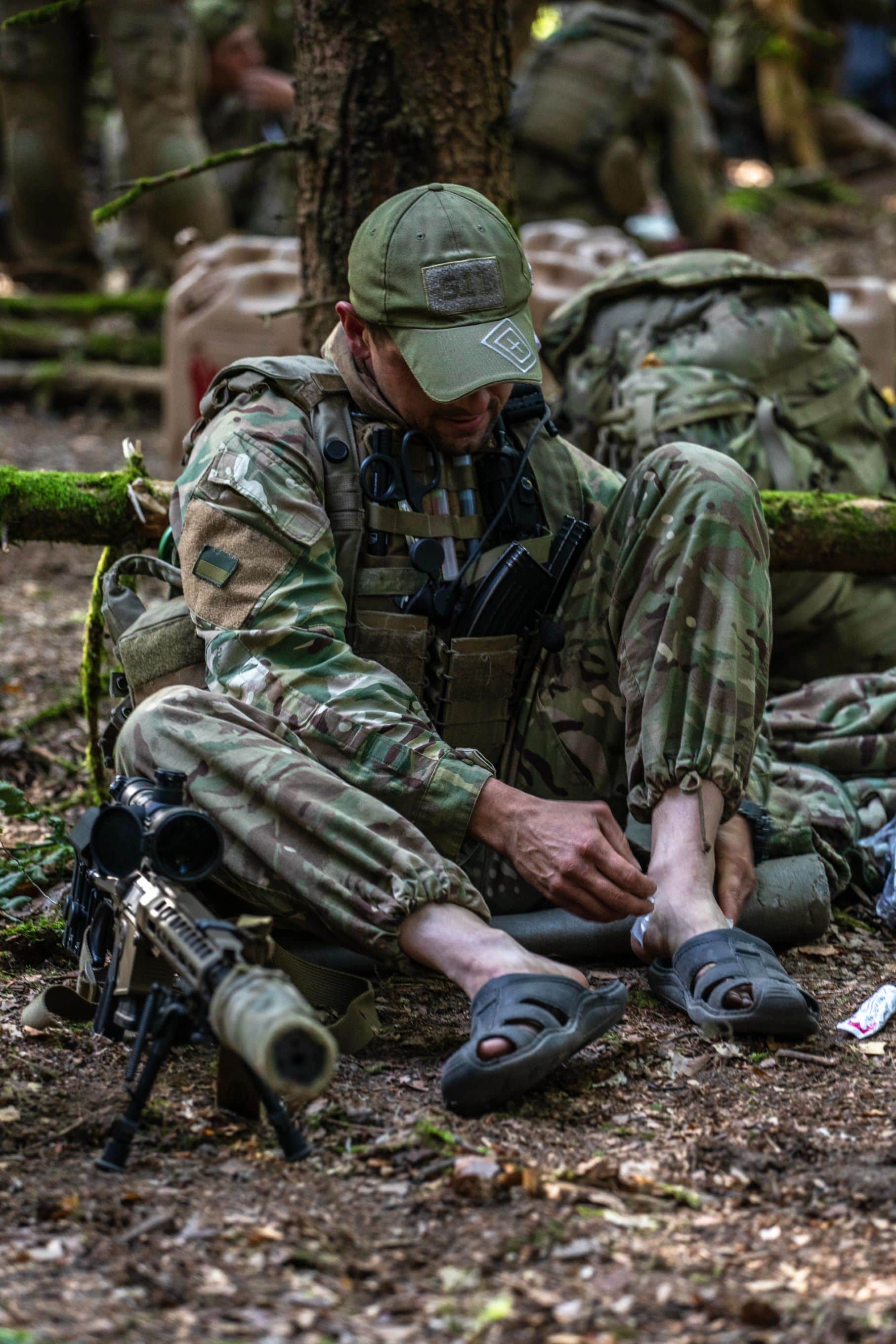 A Ukrainian special forces Soldier bandages his feet after a raid during Exercise Combined Resolve 14 at Hohenfels, Germany, September 18, 2020. Combined Resolve 14 partnered about 160 Multinational SOF from Ukraine, North Macedonian, the U.S., and members of the Lithuanian National Defense Volunteer Defense National Force, or KASP, with conventional forces to improve integration and enhance their overall combat abilities. (U.S. Army photo by Sgt Patrik Orcutt)