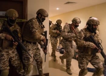 210113-N-YD651-1054 5TH FLEET AREA OF OPERATIONS (Jan. 13, 2021) Bahrain Defense Force and U.S. Naval Forces Central Command personnel simulate clearing a building during a joint anti-terrorism exercise in the U.S. 5th Fleet Area of Operations, Jan. 13. The bilateral exercise focused on enhancing mutual security and anti-terrorism capabilities by testing responses to simulated scenarios. (U.S. Navy photo by Mass Communication Specialist 2nd Class Matthew Riggs)