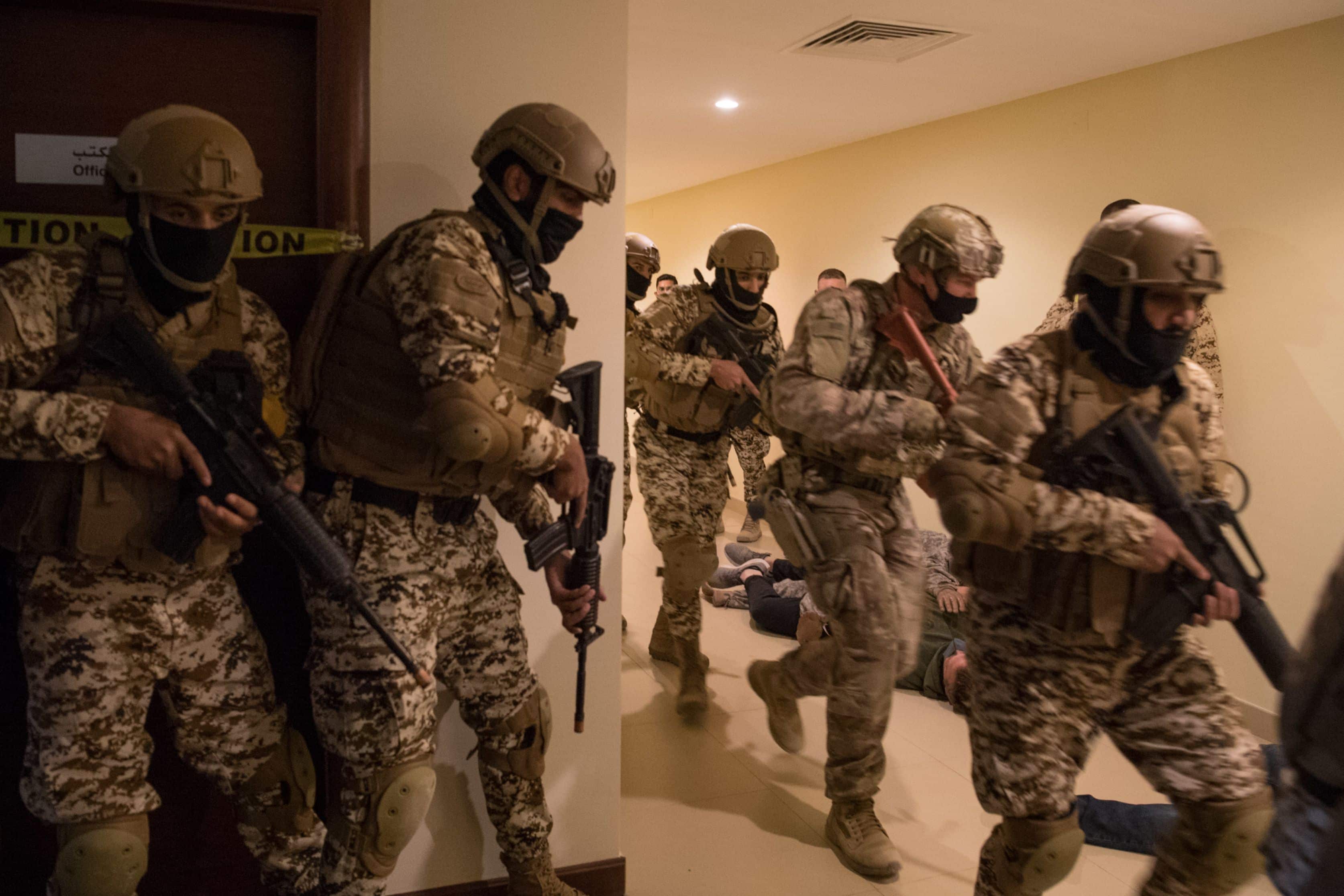 210113-N-YD651-1054 5TH FLEET AREA OF OPERATIONS (Jan. 13, 2021) Bahrain Defense Force and U.S. Naval Forces Central Command personnel simulate clearing a building during a joint anti-terrorism exercise in the U.S. 5th Fleet Area of Operations, Jan. 13. The bilateral exercise focused on enhancing mutual security and anti-terrorism capabilities by testing responses to simulated scenarios. (U.S. Navy photo by Mass Communication Specialist 2nd Class Matthew Riggs)
