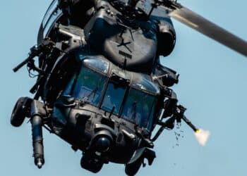U.S. Special Operations Forces members fly over Tampa Bay, Florida in a U.S. Army MH-60 helicopter during a SOF capabilities demonstration May 18, 2022. SOF Week is the premier gathering for theSOF community and industry, bringing together more than 11,000 attendees, including representatives from more than 100 countries to collaborate on new initiatives and capabilities needed for SOF professionals to compete and win in the future. (U.S. Air Force photo by Staff Sgt. Alexander Cook)