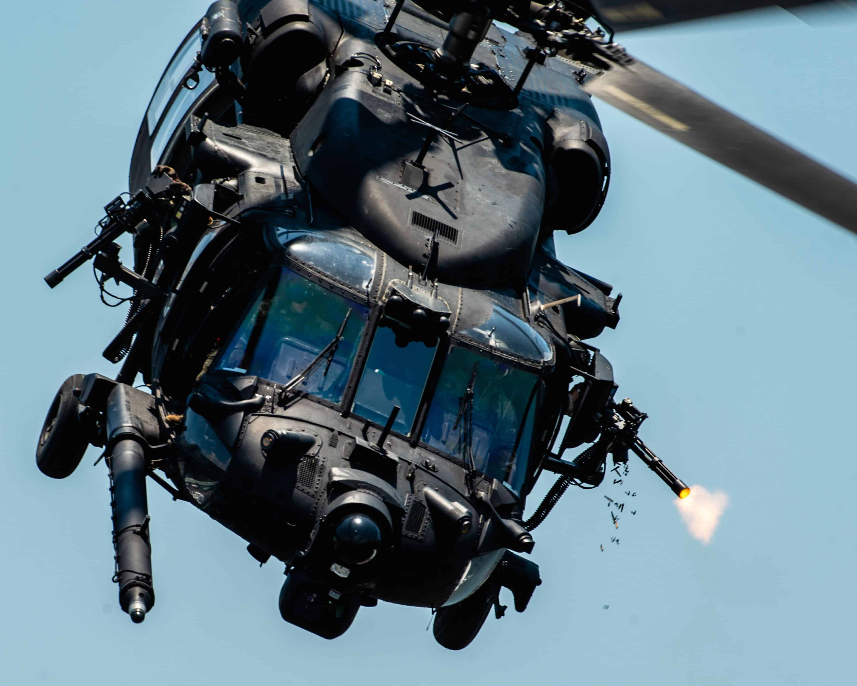 U.S. Special Operations Forces members fly over Tampa Bay, Florida in a U.S. Army MH-60 helicopter during a SOF capabilities demonstration May 18, 2022. SOF Week is the premier gathering for theSOF community and industry, bringing together more than 11,000 attendees, including representatives from more than 100 countries to collaborate on new initiatives and capabilities needed for SOF professionals to compete and win in the future. (U.S. Air Force photo by Staff Sgt. Alexander Cook)