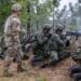 A U.S. Army Soldier observes a group of Colombian and U.S. Soldiers conduct a live fire training lane during their Joint Readiness Training Center rotation at Fort Polk, La. on May 5, 2023. (U.S. Army photo by Sgt. 1st Class Alan Brutus)