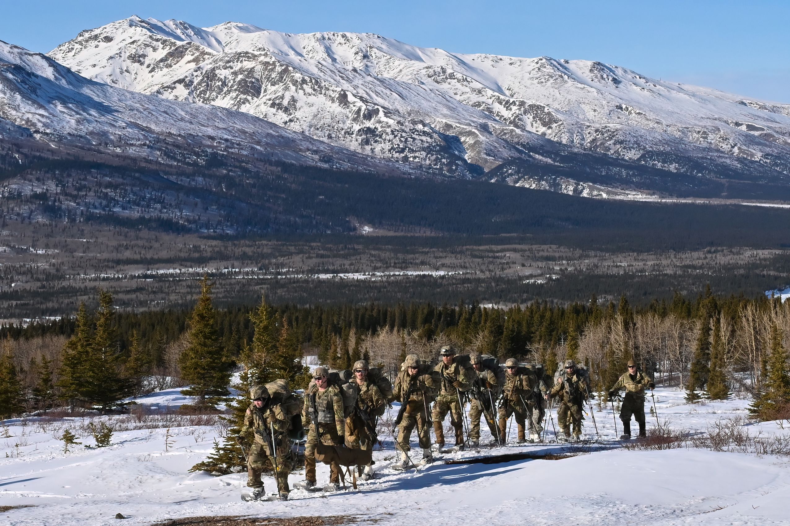 Cold Weather Leaders Course students move through the rugged terrain at the Northern Warfare Training Center's Black Rapids Training Site. NWTC cadre worked overtime to help meet the increased need for more Arctic experts in the units to help pass critical knowledge throughout the formations. (Army photo/John Pennell)