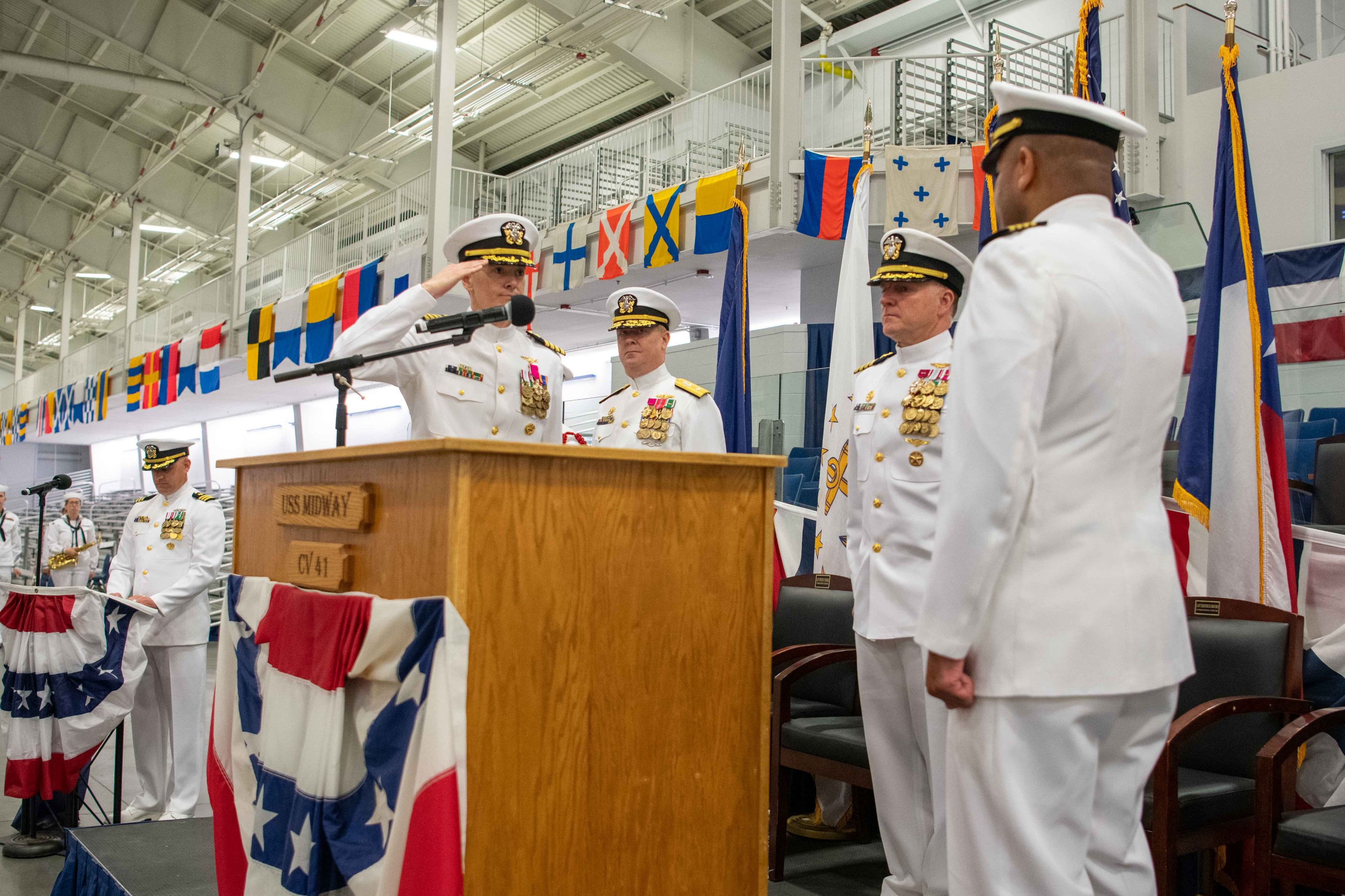 Capt. Kertreck Brooks is relieved by Capt. Kenneth Froberg as commanding officer of U.S. Navy Recruit Training Command during a change of command ceremony at Midway Ceremonial Drill Hall, Great Lakes, Illinois, July 18, 2023. More than 40,000 recruits train annually at the Navy’s only boot camp. (U.S. Navy photo by Mass Communication Specialist 1st Class Stephane Belcher)