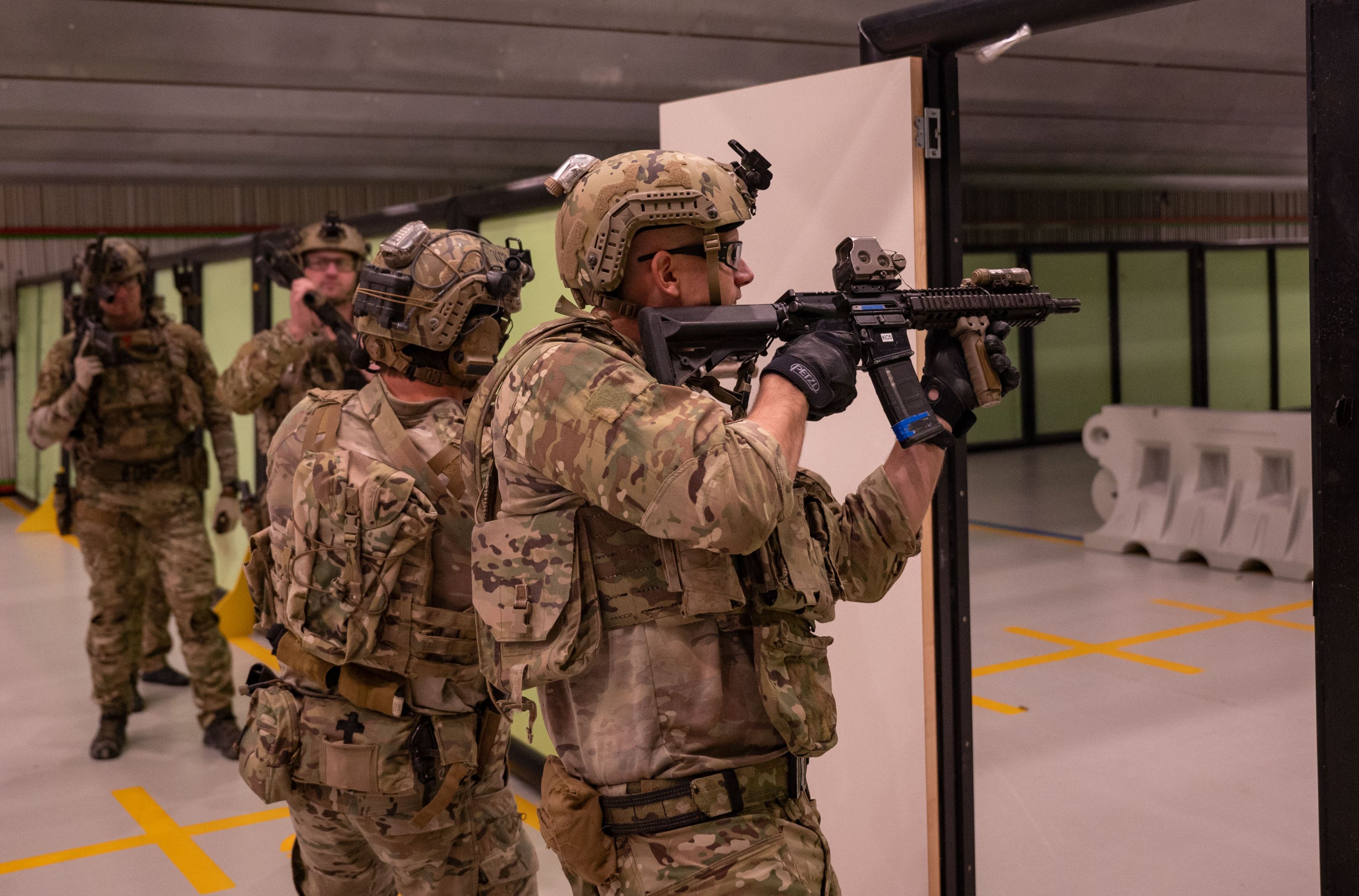 Operators from a U.S. Naval Special Warfare Unit shoot simulated targets while conducting close quarter combat training with the Australian Army 2nd Commando Regiment at Holsworthy Barracks in New South Wales, Australia during Talisman Sabre, July 20, 2023.