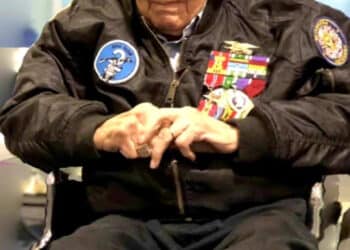 Retired U.S. Navy Chief Warrant Officer 4 Solomon Atkinson quietly waits in his wheelchair wearing his SEAL insignia, an eagle perched on a horizontal three-pronged trident, clutching a pistol, with an upright anchor, on his purple beret and decade’s worth of ribbons adorning his jacket before receiving the Alaska Governor’s Veteran Advocacy Award during a ceremony in Metlakatla, Alaska, Dec. 10, 2018.