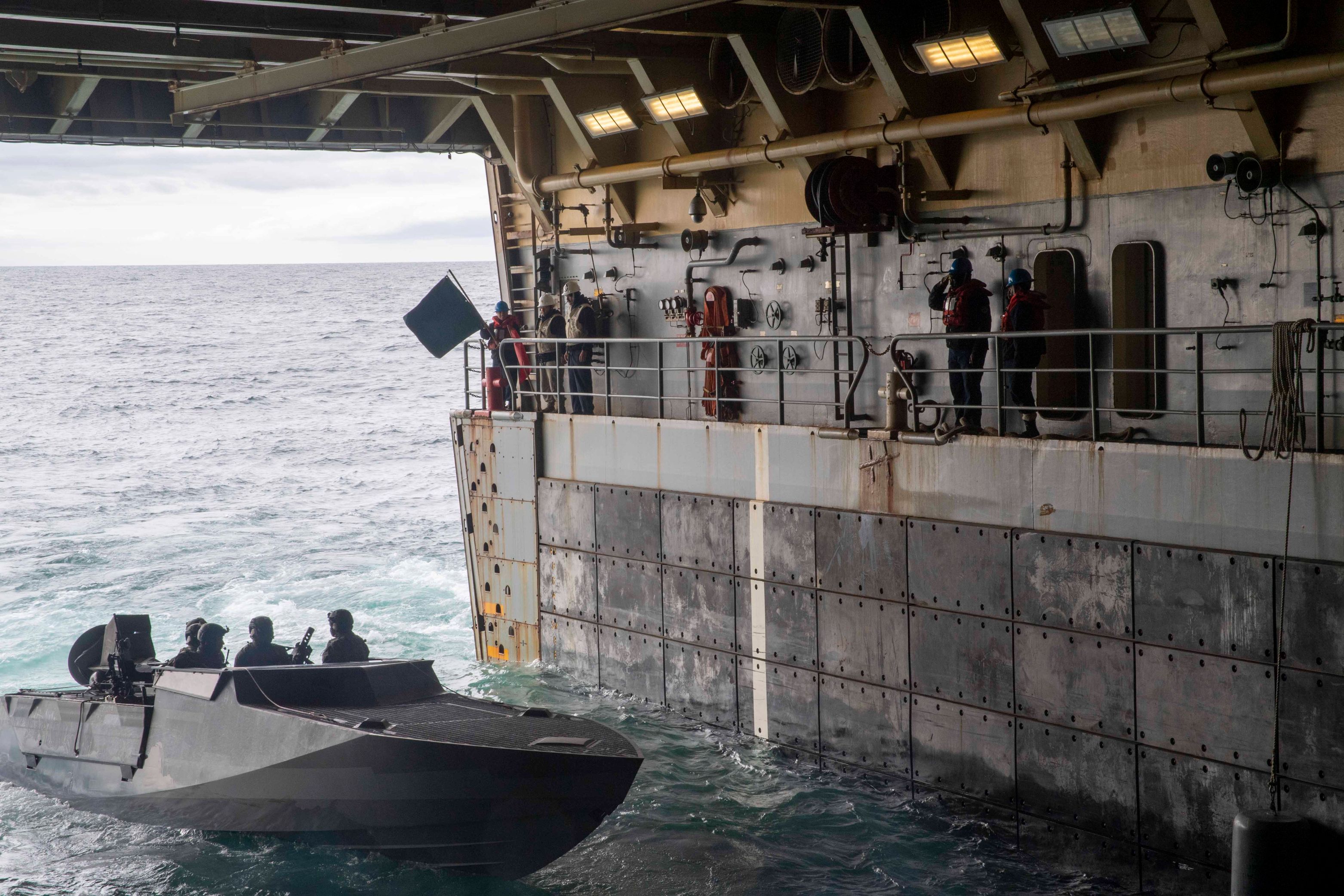 A Naval Special Warfare combatant craft assault launches from the well deck of amphibious transport dock ship USS John P. Murtha (LPD 26) during Operation POLAR DAGGER, Aug. 29, 2023.