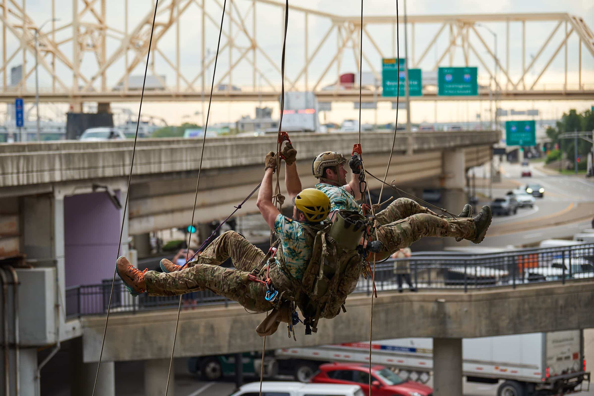 U.S. Air Force pararescuemen execute an urban high-angle ropes scenario to reach a simulated injured service member, render medical care, and lower him to safety during the PJ Rodeo competition in Louisville, Ky., Sept. 6, 2023. The biennial event, which tests the capabilities of pararescue Airmen across the service, was hosted by the Kentucky Air National Guard’s 123rd Special Tactics Squadron. (U.S. Air National Guard photo by Phil Speck)