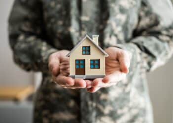 Military Army Man In Uniform Holding New House