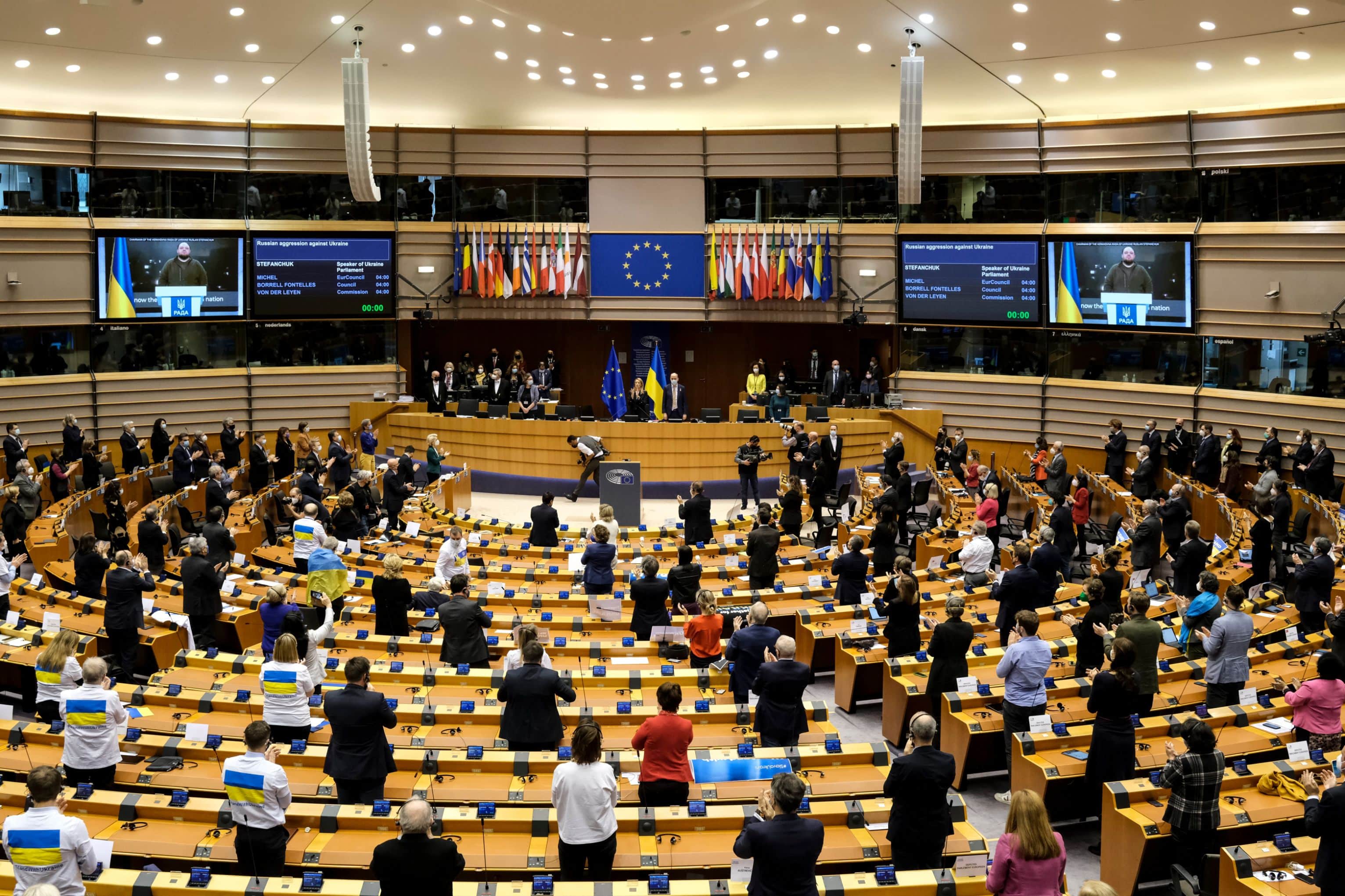 Members of the EU Parliament stand and applaud to show their support to Ukraine during an extraordinary Plenary session debating on the Russian aggression in Brussels, Belgium, 01 March 2022.