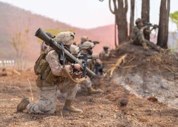 Team of U.S. Army marine corps soldier military war with gun weapon participating and preparing to attack the enemy in Thailand during exercise Cobra Gold training in battle. Combat force.