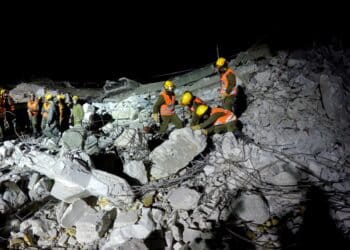 HOLON, ISRAEL JULY 27th, 2015: Homeland Security Soldiers search for earthquake rocket attack tsunami injured people digging through the rubble during night drill