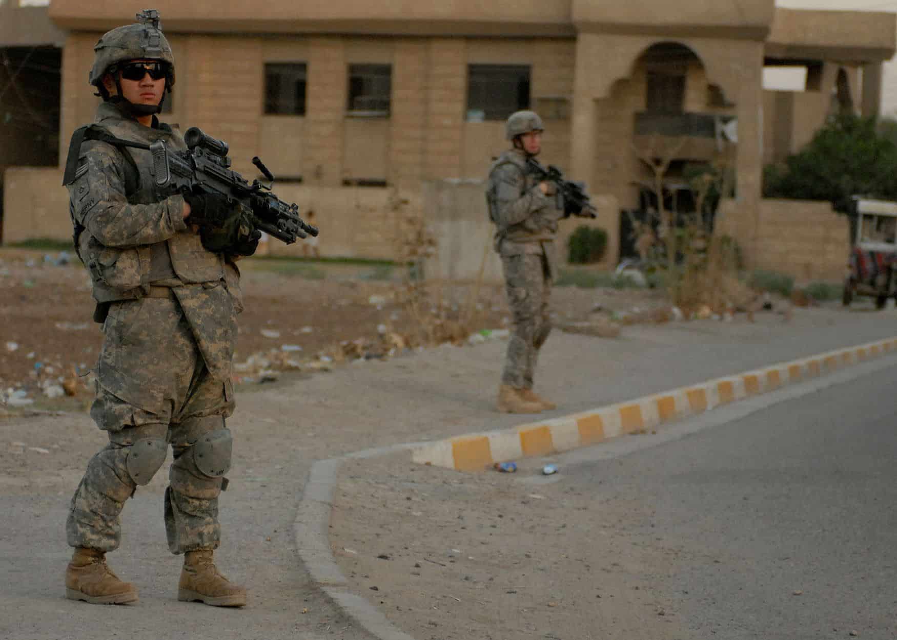 Pfc. John Henry, an infantryman from Prairie Grove, Ark., assigned to Company C, 2nd Battalion, 4th Infantry Regiment, attached to 1st Brigade Combat Team, 4th Infantry Division, Multi-National Division-Baghdad, patrols in the Doura community in southern Baghdad's Rashid district Aug. 14, 2008.