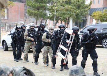 Soldiers from 188th Military Police Company "Original Warfighters" with Republic of Korea Navy Special Duty Team members prepare to engage a notional active shooter and hostage situation, March 16, 2017, at Busan Naval Base. The training enforced and enhanced joint service interoperability. (Photo by Sgt. Uriah Walker, 19th ESC Public Affairs)