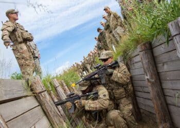 Sgt. Brett Mussyal, a U.S. Army Soldier with the 45th Infantry Brigade Combat Team, explains how to clear a trench to Ukrainian soldiers from the 1st Airmobile Battalion, 79th Air Assault Brigade while U.S. Soldiers demonstrate during trench assault and clearance training at the Yavoriv Combat Training Center on the International Peacekeeping and Security Center, near Yavoriv, Ukraine, on June 13.