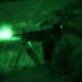 A Marine with Fox Company from the Battalion Landing Team, 2nd Battalion, 2nd Marine Regiment, 22nd Marine Expeditionary Unit, fires an M249 squad automatic weapon during a night assault at the infantry platoon battle course aboard Fort Pickett, Va., Dec. 13, 2010.