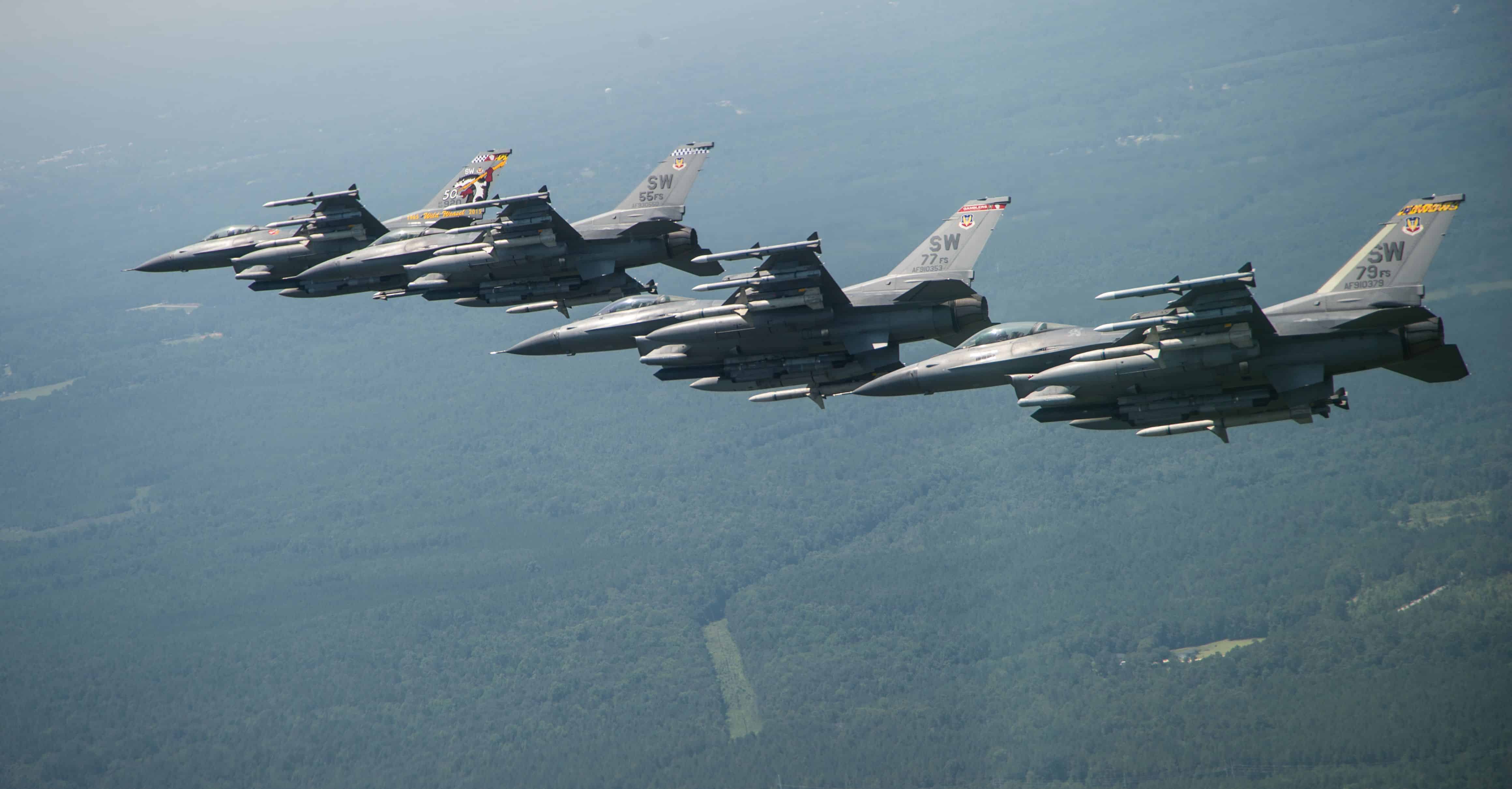 A Four-Ship formation of F-16 Fighting Falcons fly over Shaw Air Force Base, S.C., 21 July, 2017, as part of a commemoration of the hundredth anniversary of the 55th Fighter Squadrons activation. The formation consisted of the wing flagship aircraft from the 55th, 77th, and 79th fighter squadrons all stationed at Shaw AFB. (U.S. Air Force Photo by Tech. Sgt. Gregory Brook)