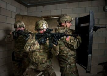 U.S. Army Reserve military police Soldiers from the 430th Military Police Detachment (Law Enforcement), located in Red Bank, New Jersey, run through a Military Operations on Urban Terrain (MOUT) drill during a photo shoot for Army Reserve recruiting at Joint Base McGuire-Dix-Lakehurst, New Jersey, July 25, 2017.