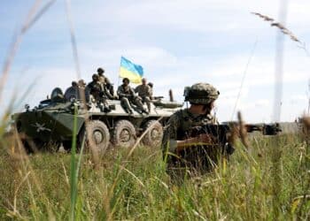 A Ukrainian soldier keeps security while a convoy passes during an Operational Capabilities Concept evaluation at the International Peacekeeping and Security Centre in Yavoriv, Ukraine, Sept. 11, 2018.