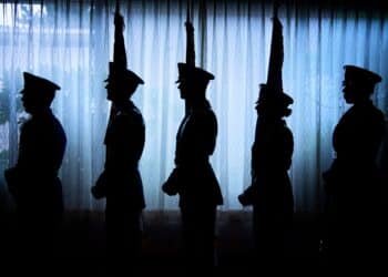 The Yokota Air Base Honor Guard stands by to present the colors during a promotion ceremony at Yokota Air Base, Japan, June 27, 2019. Their mission is to provide professional military honors for all official military and civil ceremonies as required by the wing, and higher headquarters. (U.S. Air Force photo by Yasuo Osakabe)