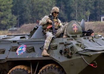 A soldier from the Armed Forces of Ukraine prepares for a fire team movement and room clearing demonstration as part of Rapid Trident 2019, Sept. 20, 2019, near Yavoriv, Ukraine. RT19 is an annual, multinational exercise, which involves approximately 3,700 personnel from 14 nations, that support joint combined interoperability among partner militaries of Ukraine and the United States, as well as Partnership for Peace nations and NATO allies. (U.S. Army photo by Pvt. Joanna Gaona Gomez)