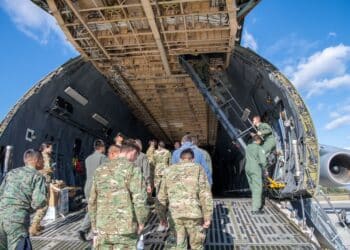 Cadets from the Latin American Cadet Initiative climb the troop compartment stairs on a C-5M Super Galaxy during their visit Oct. 17, 2019, at Dover Air Force Base, Del. The cadets were transported to the flight line to tour a static C-5M Super Galaxy after the briefings in the 3rd Airlift Squadron auditorium. (U.S. Air Force photo by Senior Airman Christopher Quail)