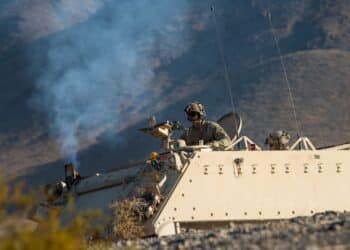 U.S. Army Soldiers assigned to the 3rd Brigade Combat Team, 1st Armored Division at Fort Bliss, Texas, ride in an Armored Personnel Carrier during a Green Flag West 21-02 exercise, at Fort Irwin Army Base, California, Nov. 13, 2020. Green Flag-West is a realistic air-land integration combat training exercise involving the air forces of the United States and its allies. It focuses on integration and presents joint force commanders real-time battle scenarios to solve while facing opposition forces. (U.S. Air Force photo by Airman 1st Class Dwane R. Young)