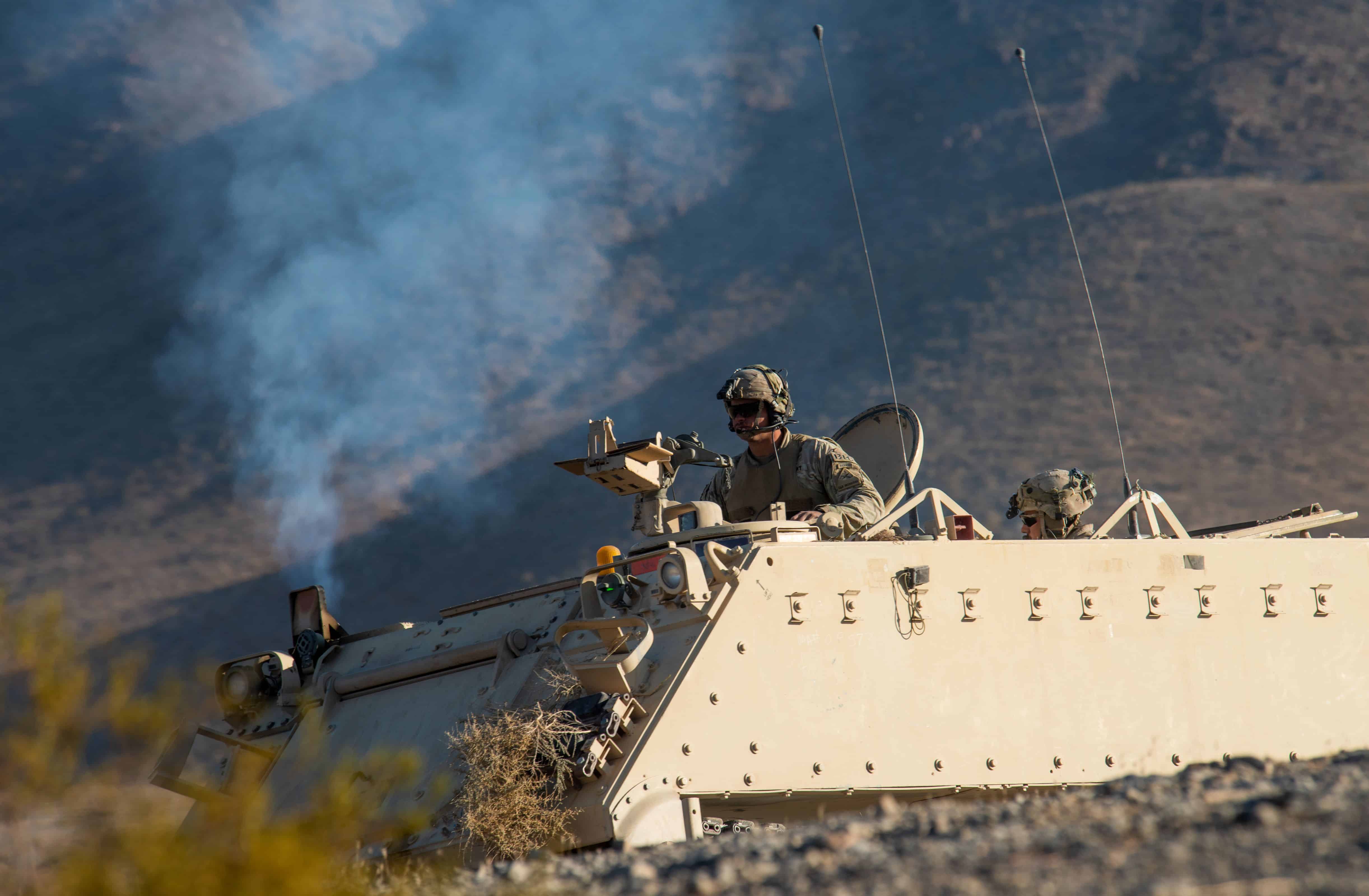U.S. Army Soldiers assigned to the 3rd Brigade Combat Team, 1st Armored Division at Fort Bliss, Texas, ride in an Armored Personnel Carrier during a Green Flag West 21-02 exercise, at Fort Irwin Army Base, California, Nov. 13, 2020. Green Flag-West is a realistic air-land integration combat training exercise involving the air forces of the United States and its allies. It focuses on integration and presents joint force commanders real-time battle scenarios to solve while facing opposition forces. (U.S. Air Force photo by Airman 1st Class Dwane R. Young)