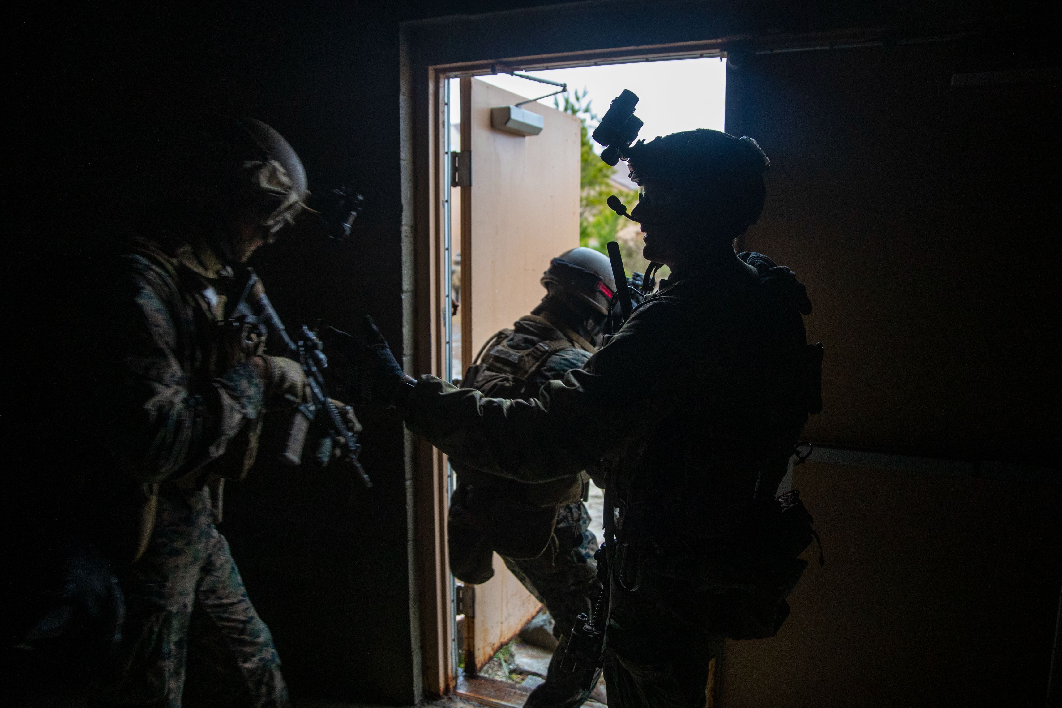 U.S. Marines with 2d Battalion, 6th Marine Regiment, 2d Marine Division exit a building during a Military Operations in Urban Terrain (MOUT) assault raid on Camp Lejeune, N.C., Jan. 12, 2021.
