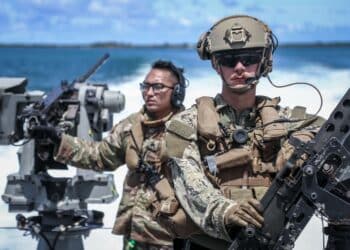 APRA HARBOR, Guam (Sept. 28, 2021)Electronics Technician 3rd Class Paul Shaffer of Maritime Expeditionary Security Squadron (MSRON) 4, trains with Sgt. Keoni Wong, flight medic with the Guam Army National Guard, aboard a Mark VI Patrol Boat during a joint exercise in Guam, Sept. 28.