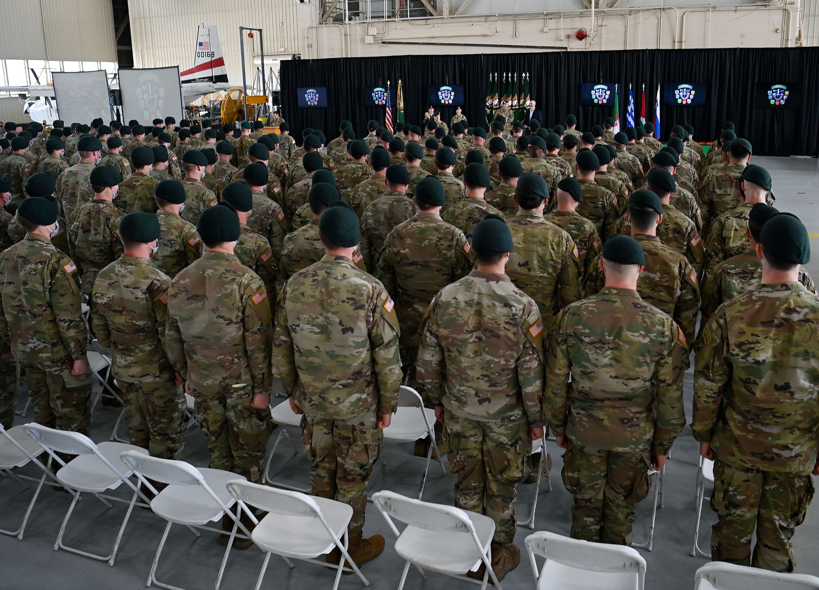 Soldiers assigned to the U.S. Army John F. Kennedy Special Warfare Center and School stand in formation after donning their green berets for the first time during a Regimental First Formation at Fort Bragg, North Carolina February 17, 2022